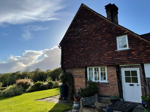 Lodge Farmhouse — the historic brick farmhouse with manicured lawn